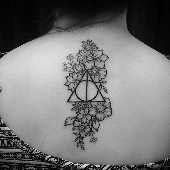 Floral Deathly Hallow Tattoo on Women Spinal