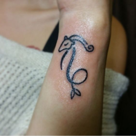 Women Painted Capricorn Tattoo on Wrist